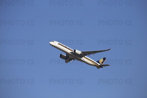 A Singapore Airlines passenger aircraft takes off from Frankfurt Airport