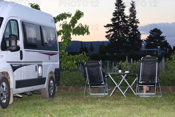 Camping holiday in Germany: motorhome at sunset on the Rehm winery pitch in Edesheim, Palatinate