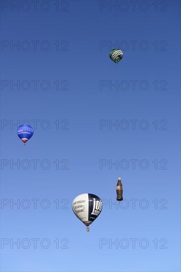 Four hot air balloons in the blue sky, Montgolfiade Tegernseer Tal, Balloon Week Tegernsee, Warngau, Bavarian Oberland, Upper Bavaria, Bavaria, Germany, Europe