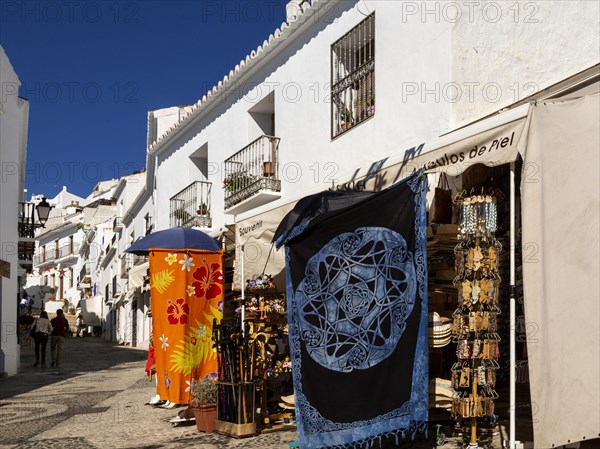 Souvenir shop with clothing and craftwork on display, Frigiliana, Axarquia, Andalusia, Spain, Europe