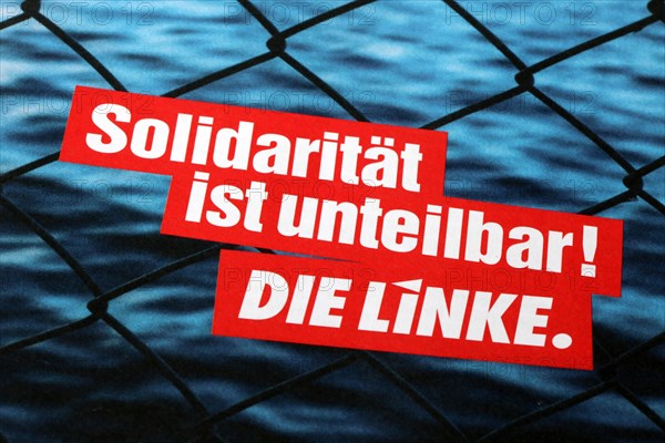 Symbolic image Die Linke: Flyer with the slogan Solidarity is indivisible