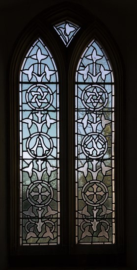 Stained glass window in church of All Saints church, South Elmham, Suffolk, England, UK late nineteenth century leaded pattern