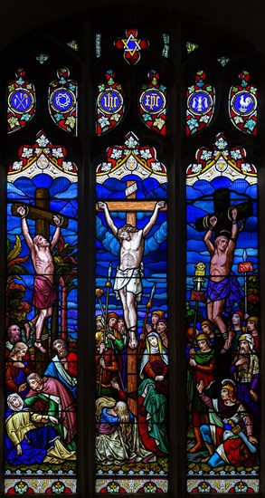 Stained glass window Crucifixion, c 1865 by H Hughes, Wetherden church, Suffolk, England, UK