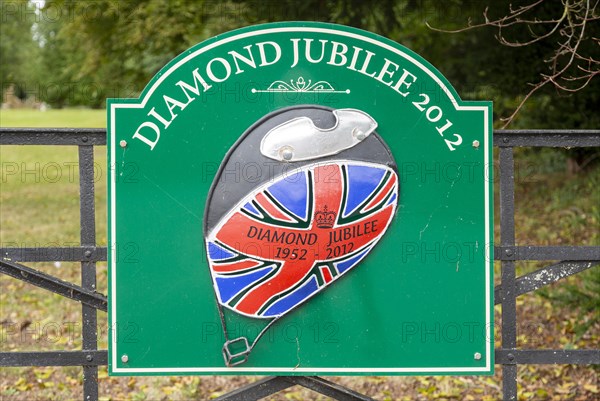 Sign for Diamond Jubilee 1952-2012 on gate entrance to public park, Netheravon, Wiltshire, England, UK