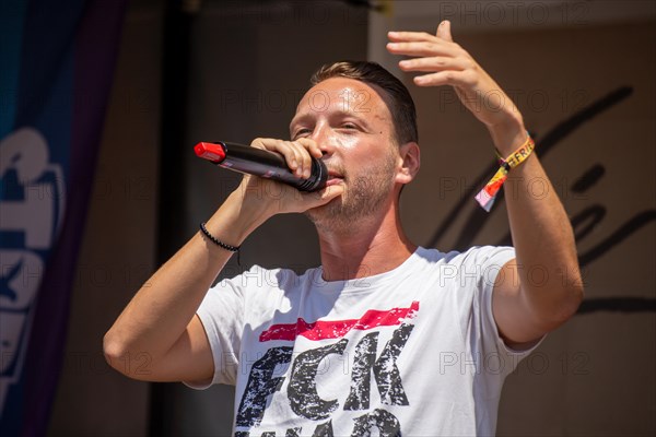 Rapper and peace activist Kilez More sings against war and armament and in favour of diplomacy and negotiations at the peace demonstration in front of Ramstein Air Base