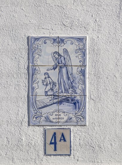 Azulejo tile ceramic image of guardian angel above house door, village of Alvito, Baixo Alentejo, Portugal, southern Europe, Europe