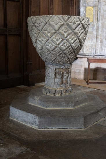 12th century stone font bowl with carved lozenge pattern, Ramsbury church, Wiltshire, England, UK