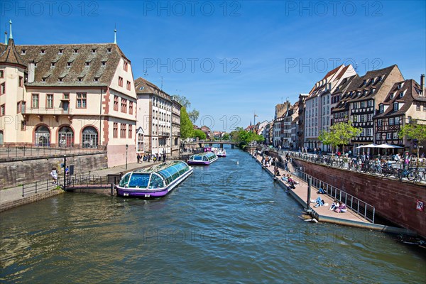 Colourful hustle and bustle on one of the many canals in Strasbourg, France, Europe