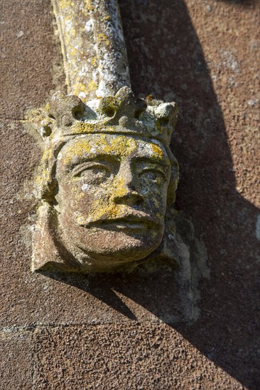 Village parish church at Trimley St Mary, Suffolk, England, UK detail of stonework carved king head