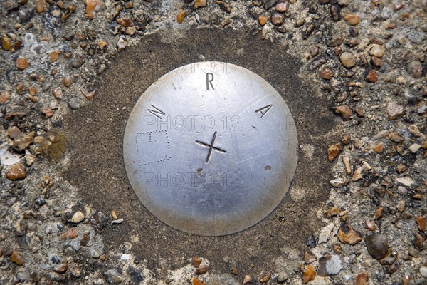 Looking down from above onto steel National Rivers Authority E1 location marker, Shingle Street, Suffolk, England, UK