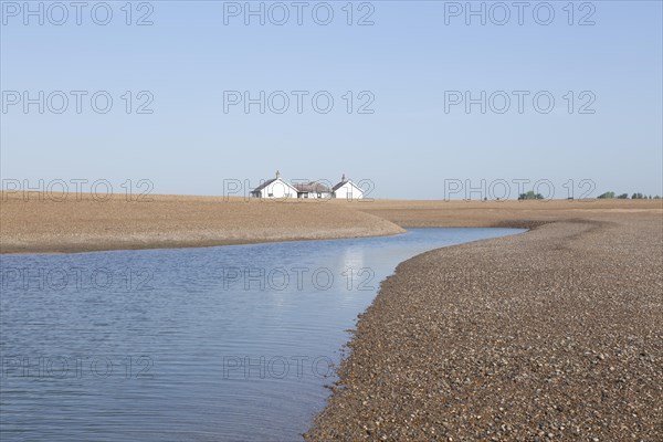 Bungalow house 'The Beacons' at risk of coastal erosion, close to the sea, Shingle Street, Suffolk, England, UK