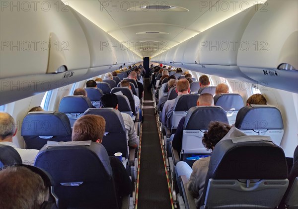 Passengers in the interior of a small aeroplane, Duesseldorf, North Rhine-Westphalia, Germany, Europe