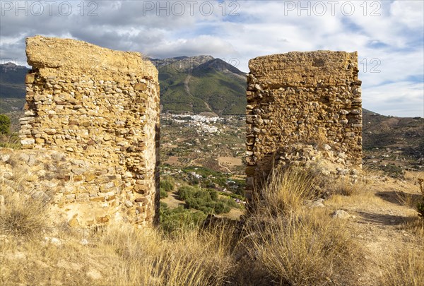 Ruins Castle of Zalia, La Axarquia, province of Malaga, Andalusia, Spain village Alcaucin village in background
