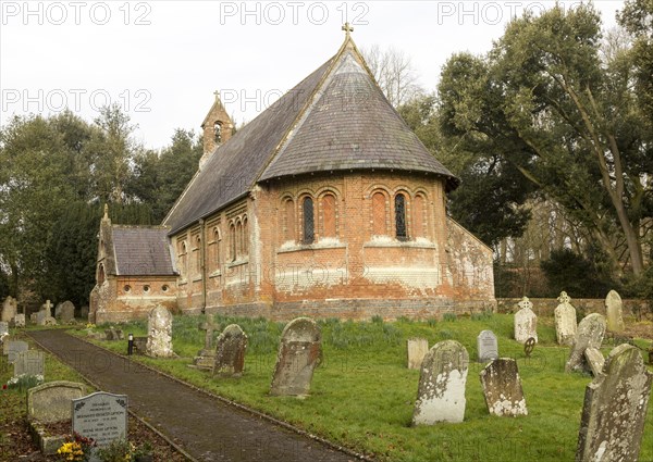 Holy Trinity Village parish church Oare, Wiltshire, England, UK built 1858 red brick Victorian nineteenth century building