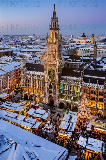Snow-covered Marienplatz with Christmas market, Christmas market and town hall at dusk, Munich, Upper Bavaria, Bavaria, Germany, Europe