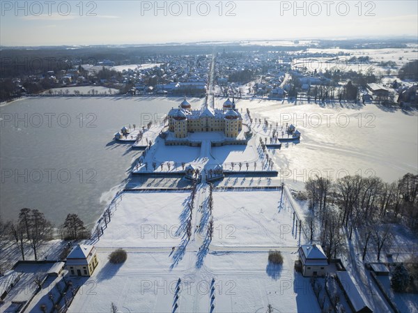 Moritzburg Castle on the castle island surrounded by the frozen castle pond, Moritzburg, Saxony, Germany, Europe