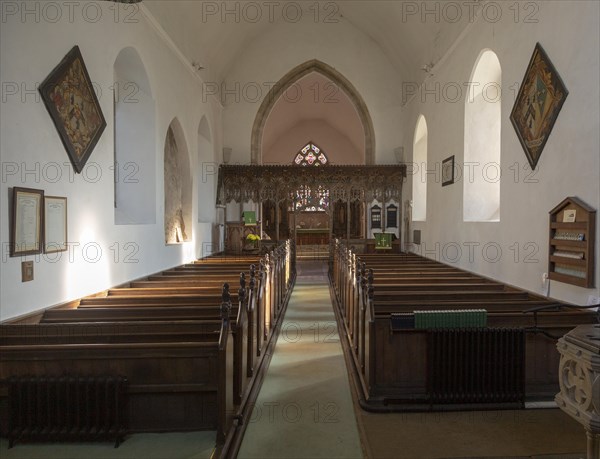 Elaborately decorated wooden rood screen in church of Saint Andrew, Bramfield, Suffolk, England, UK