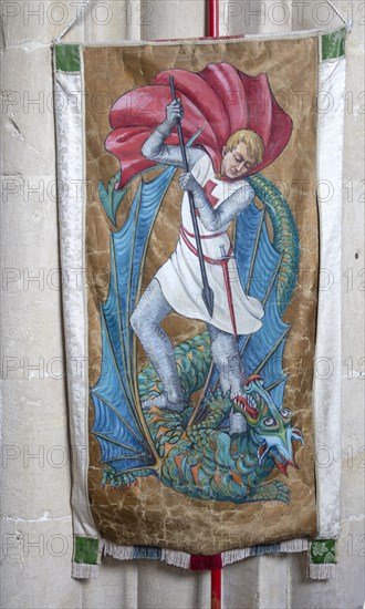 Interior of the priory church at Edington, Wiltshire, England, UK, banner of Saint George killing the dragon