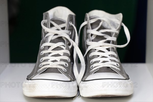 Grey Chucks on a shelf