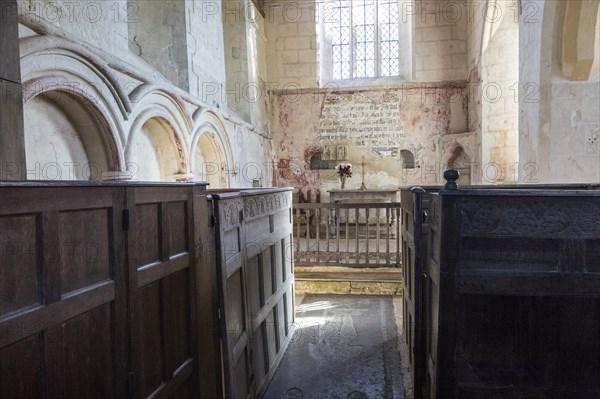 Historic interior of church of Saint John, Inglesham, Wiltshire, England, UK under the care of the Churches Conservation Trust