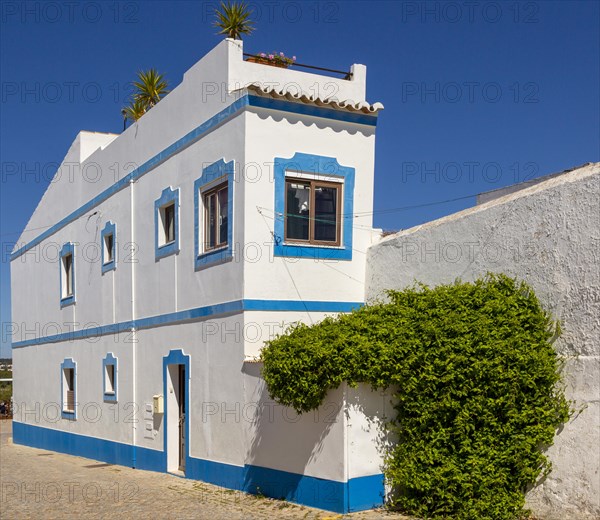 Traditional architecture building style house with whitewashed walls and blue painted features, Cacela Velha, Vila Real de Santo Antonio, Algarve, Portugal, Southern Europe, Europe