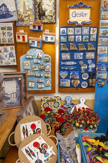 Close up tourist souvenir products on sale including fridge magnets, city of Evora, Alto Alentejo, Portugal, southern Europe, Europe