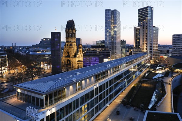 View of Breitscheidplatz in the evening with the Bikini building, the Kaiser Wilhelm Memorial Church, the Walldorf Astoria Hotel and the Upper West skyscraper, Berlin, 27.04.2021