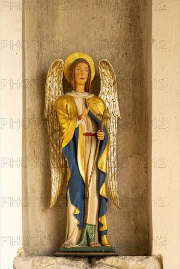 Interior historic village parish church, Wingfield, Suffolk, England, UK statue Angel Gabriel