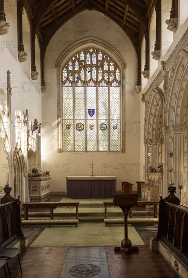 Interior historic village parish church, Wingfield, Suffolk, England, UK altar and east window