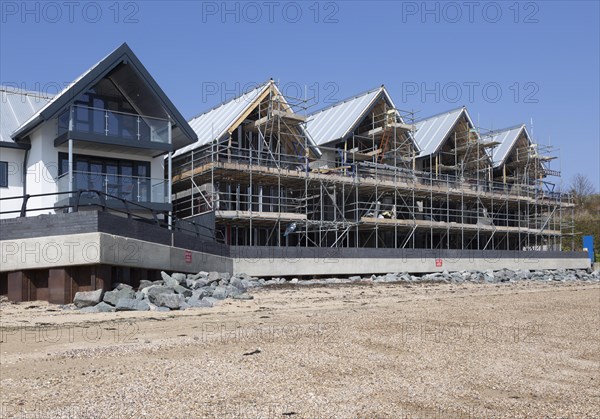 New beachfront modern housing development, Admiralty Pier, Shotley, Suffolk, England, UK under construction