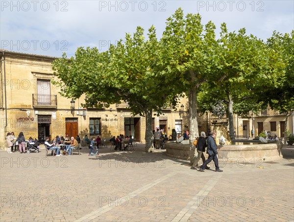 People sitting outside a cafe in Plaza Mayor, village of San Vicente de la Sonsierra, La Rioja, Spain, Europe