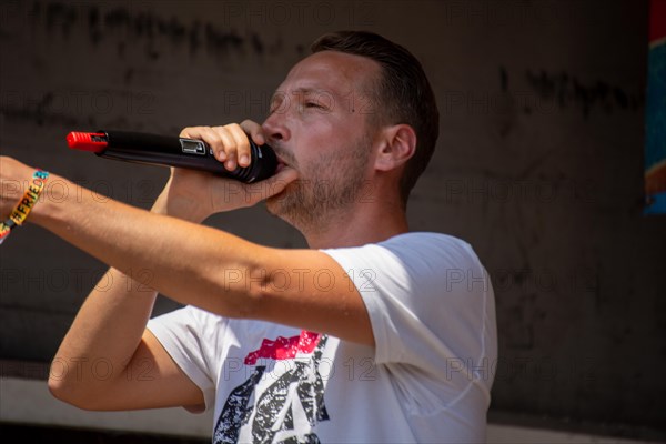 Rapper and peace activist Kilez More sings against war and armament and in favour of diplomacy and negotiations at the peace demonstration in front of Ramstein Air Base