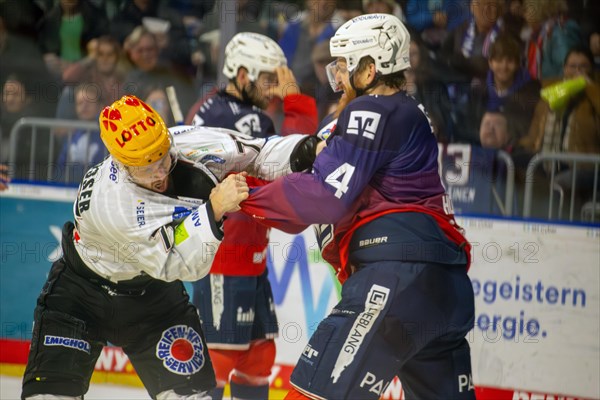 Adler Mannheim v Fischtown Pinguins Bremerhaven (PENNY DEL, German Ice Hockey League) : Fistfight between Korbinian Holzer and Phillip Bruggisser