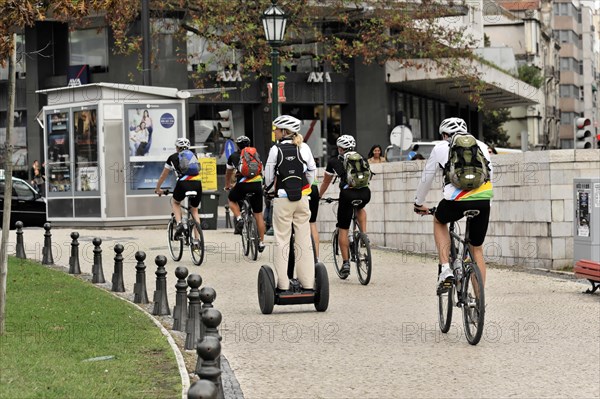 Tourists on a cruise ship during a shore excursion with bicycles and Segway, Praca Marques de Pombal, Lisbon, Lisboa, Portugal, Europe