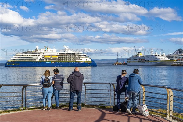 People watching cruise ships in the harbour at the Beagle Channel, Ushuaia, Tierra del Fuego Island, Patagonia, Argentina, South America