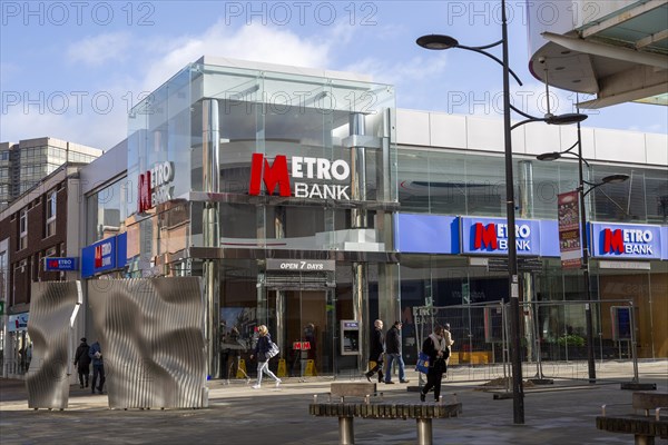 Signs on Metro Bank building, Regent Street, Swindon, Wiltshire, England, UK