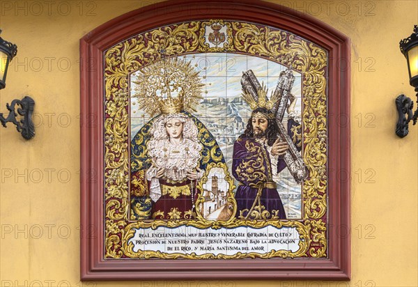 â€˜La Magna: camino de la gloria' religious procession through city streets to commemorate the centenary of brotherhood groups. Malaga, Spain. 30th Oct, 2021 ceramic tile sign, Cofradia de Nuestro Padre Jesus El Rico y Maria Santisima del Amor