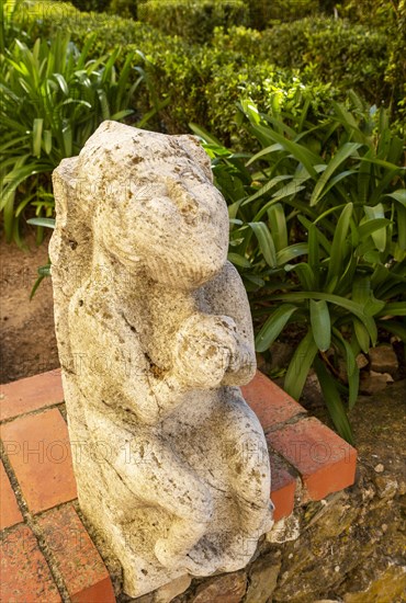 Historic stone carved stonework figure in castle garden of the Pousada Castelo de Altivo, Alvito, Baixo Alentejo, Portugal, southern Europe, Europe