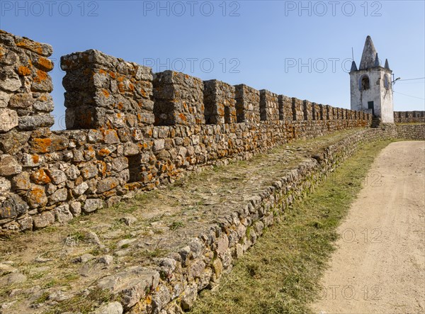 Battlements stone ramparts and watch tower in historic castle ruins at Arraiolos, Alentejo, Portugal, southern Europe, also known as Paco dos Alcaides built in 14th century, Europe