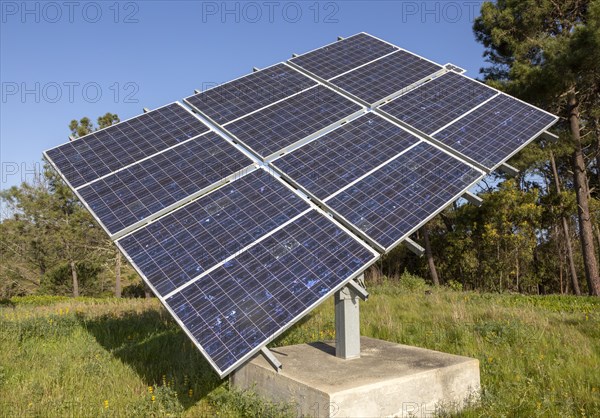 Solar panel array in rural location of field in countryside providing domestic energy near village of Rogil, Algarve district, Portugal, southern Europe, Europe