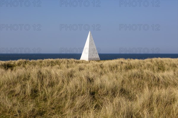 Emmanuel Head white pyramidal navigation beacon, Holy Island, Northumberland, England, UK built 1801-10 by Trinity House