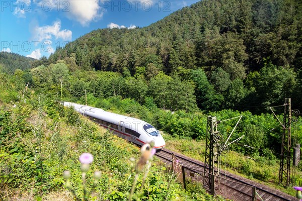 ICE (Intercity Express) in the Palatinate Forest. The train is on its way from Frankfurt to Paris. With intermediate stops in Mannheim, Kaiserslautern and Saarbruecken, it takes six hours to reach the French capital