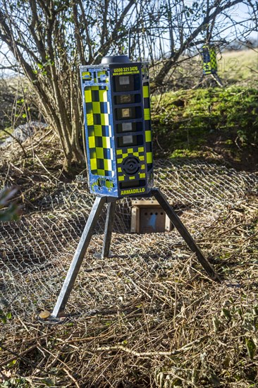 Eviction of badgers clearance of badger sett using metal fencing and one way exit gates, part of HS2 project near Kenilworth, Warwickshire, England, November 2020. Armadillo Videoguard surveillance robots used to observe site and detect protestors