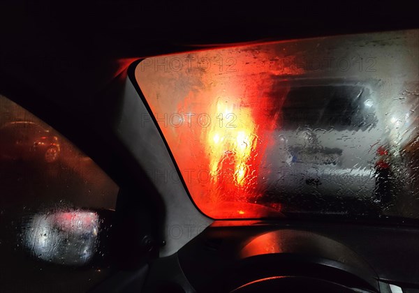 View from the car in dangerously poor visibility at night with rain and blinding backlight, Dortmund, Ruhr area, Germany, Europe