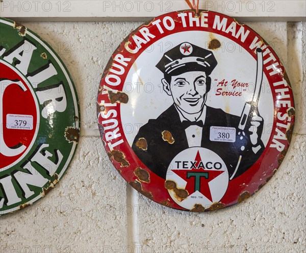 Vintage Texaco oil petrol metal advertising sign on display at auction