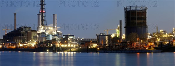 Evening shot of BASF in Ludwigshafen with the Rhine in the foreground
