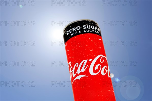 Composing of a can of Coca-Cola and a blue sky as background