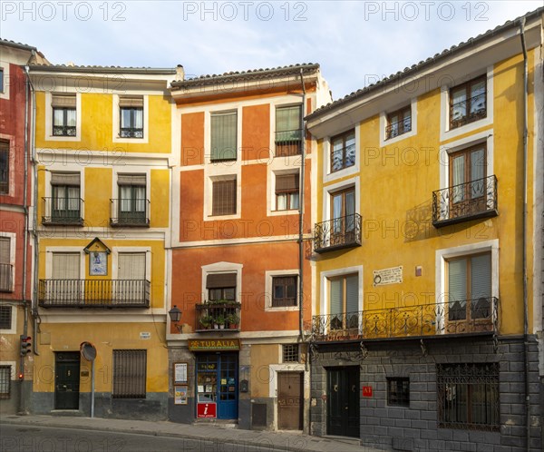 Colourful narrow historic building in a row in old part of city of Cuenca, Castille La Mancha, Spain, Europe