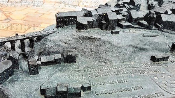 The historic city centre of Dingolfing with a view of the bronze city map. Dingolfing, Lower Bavaria, Bavaria, Germany, Europe