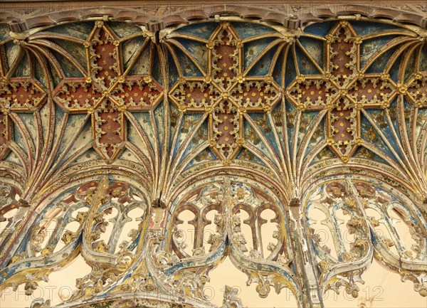 Elaborately decorated wooden rood screen in church of Saint Andrew, Bramfield, Suffolk, England, UK